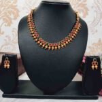 Unique Temple Design Ruby & Green Stone Golden Balls Matte Finish Necklace and Earring Set