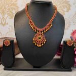 Unique Temple Design Ruby & Green Stone Golden Balls Matte Finish Necklace and Stud Earring Set