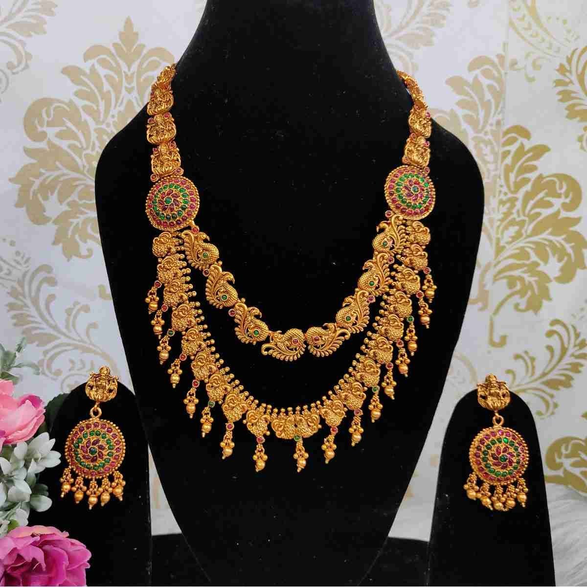 Double Layered Matte Finish Ruby, Green Stone with Golden Balls Peacock Design Temple Haram Necklace With Earrings